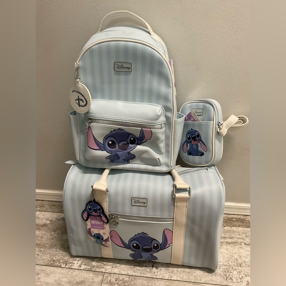 Disney Handbags - NWT Stitch weekender, backpack, and phone crossbody bag